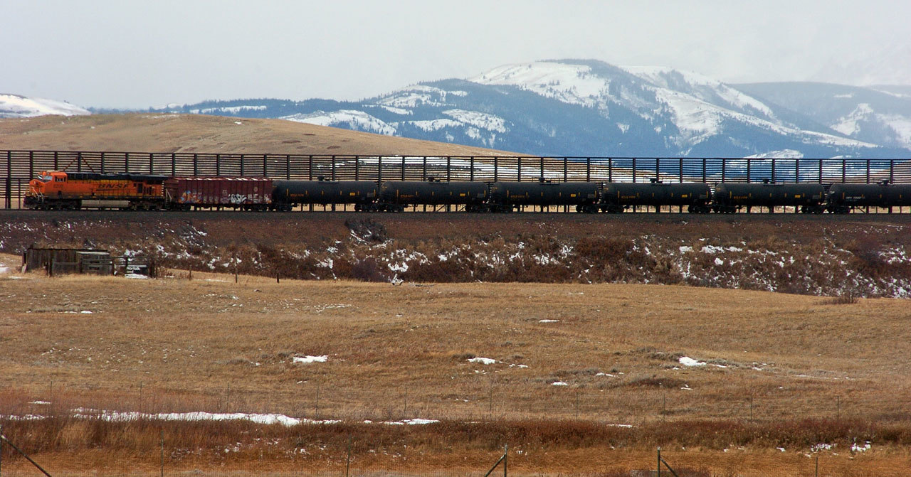 In this Nov. 7, 2013 photo, a train hauls oil into Glacier National Park near the Badger-Two Medicine National Forest in northwest Montana. Companies proposing to build the nation’s largest oil-by-rail marine terminal in southwest Washington state and their foes will argue their cases before a state energy panel in Vancouver, Washington, on Monday. (Matthew Brown / Associated Press, File)