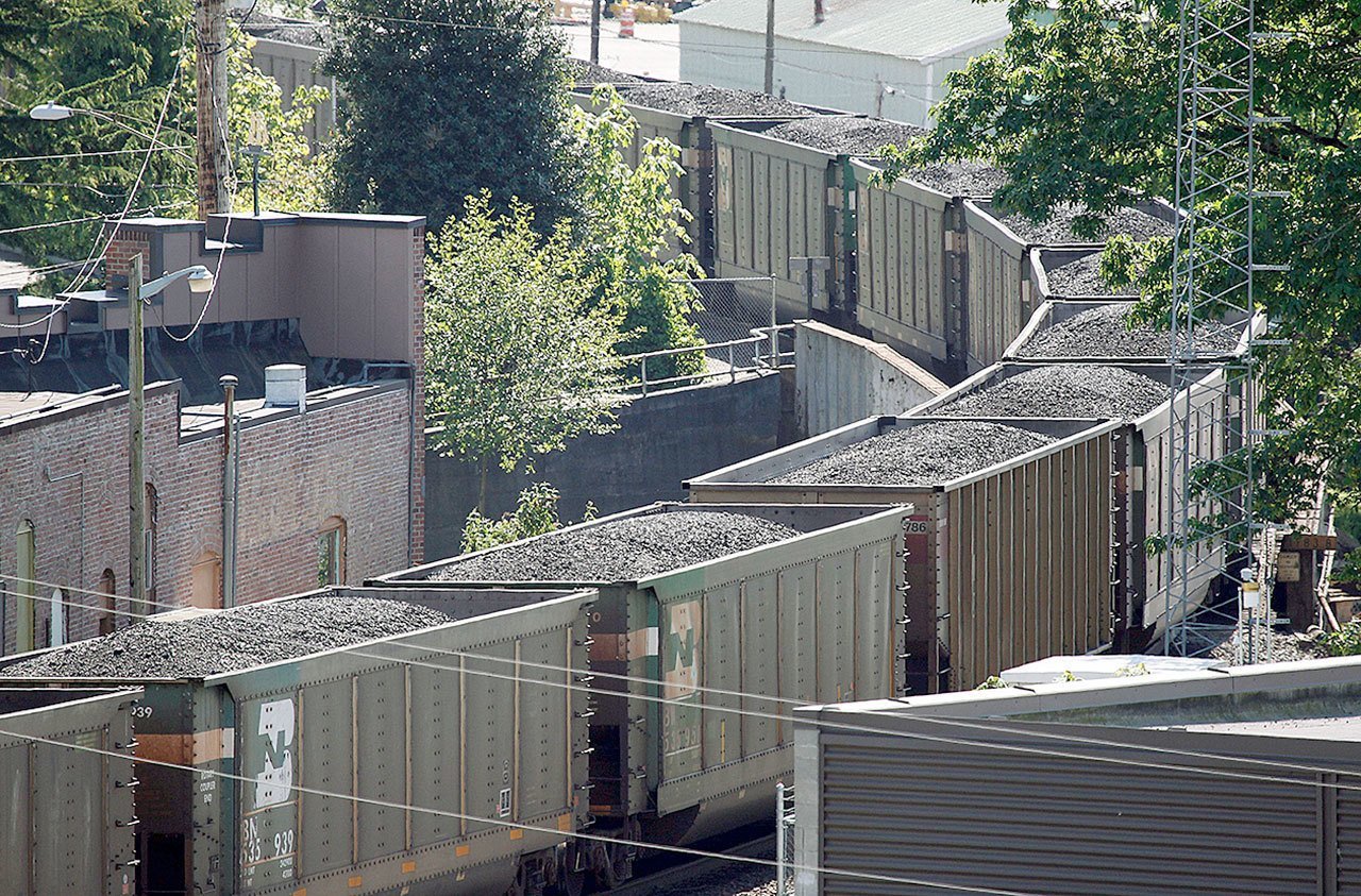 A coal train passes through Everett in 2013. Shipments of coal in Western Washington have been controversial. In Oakland, California, the City Council approved an ordinance that bans the transport, handling and storage of coal and petroleum coke at bulk material facilities or terminals. (Jennifer Buchanan / Herald file)