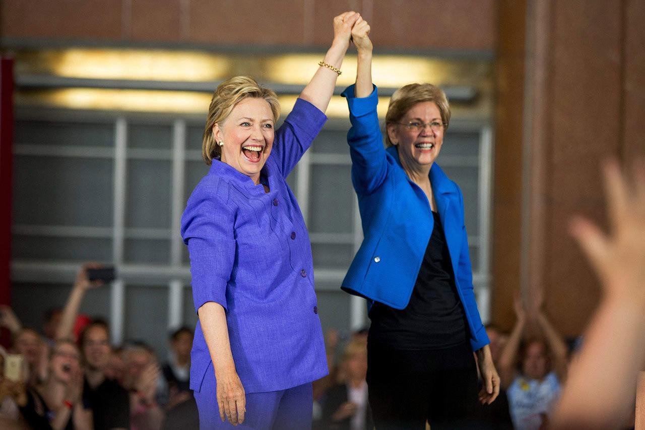 Democratic presidential candidate Hillary Clinton, accompanied by Sen. Elizabeth Warren, D-Mass., arrives to speak at the Cincinnati Museum Center at Union Terminal in Cincinnati on Monday. (Andrew Harnik / Associated Press)