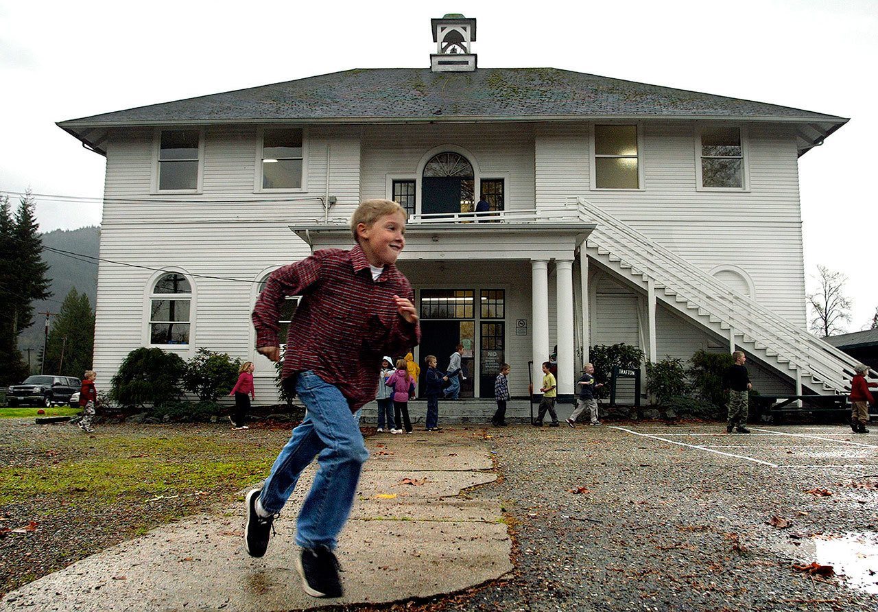 Levi Merritt of Oso enjoys a game of kickball during a rainy morning recess at Trafton Elementary School in Arlington. (Herald file, 2005)