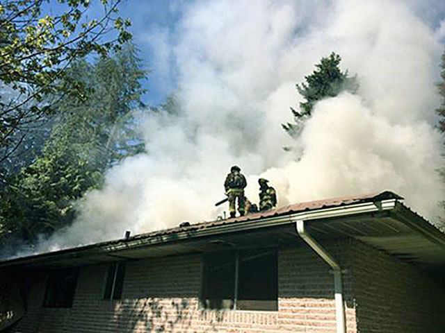 It took crews several hours to extinguish a house fire Monday south of Arlington. (Snohomish County Fire District 21)