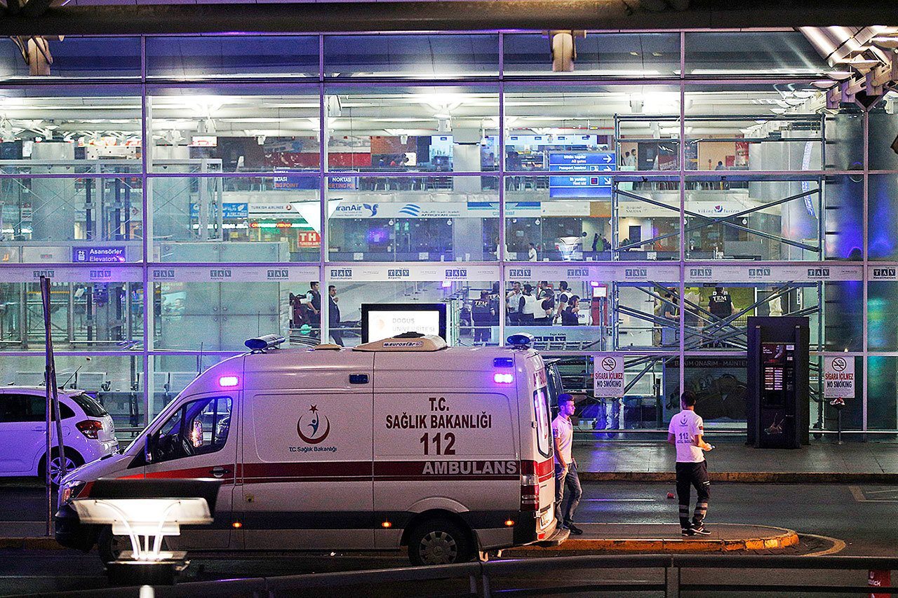 Turkish rescue services gather outside Istanbul’s Ataturk airport Tuesday. Explosions have rocked Istanbul’s Ataturk airport, killing many people and wounding scores of others, Turkey’s justice minister and another official said Tuesday. (Emrah Gurel / Associated Press)