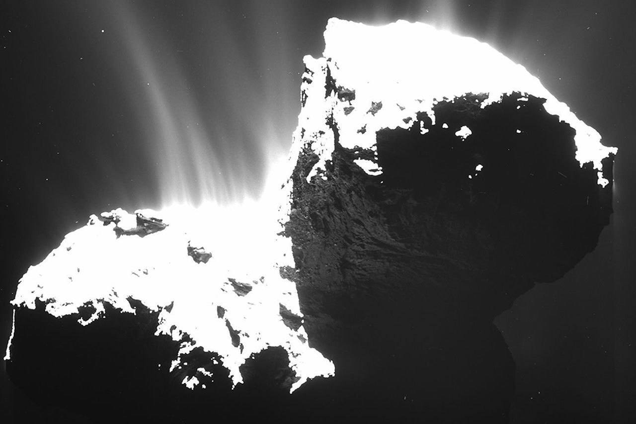 The photo released by ESA and taken by OSIRIS wide-angle camera on the Rosetta space probe on Nov. 22, 2014 from a distance of 18.6 miles from Comet 67P/Churyumov-Gerasimenko shows the faint jets of the comet’s activity. (ESA/Rosetta/OSIRIS via AP)