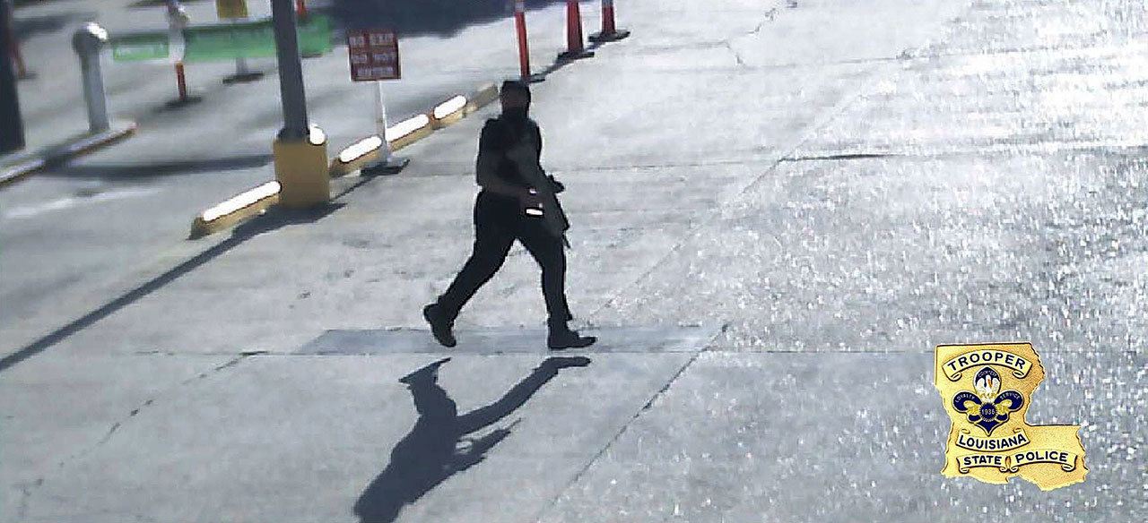 A frame from security video provided by the Louisiana State Police shows Gavin Eugene Long carrying a weapon in Baton Rouge, Lousiana. Authorities said Long ambushed law enforcement officers, fatally shooting multiple officers and injuring several others before he was killed by a police sniper. (Louisiana State Police via Associated Press)