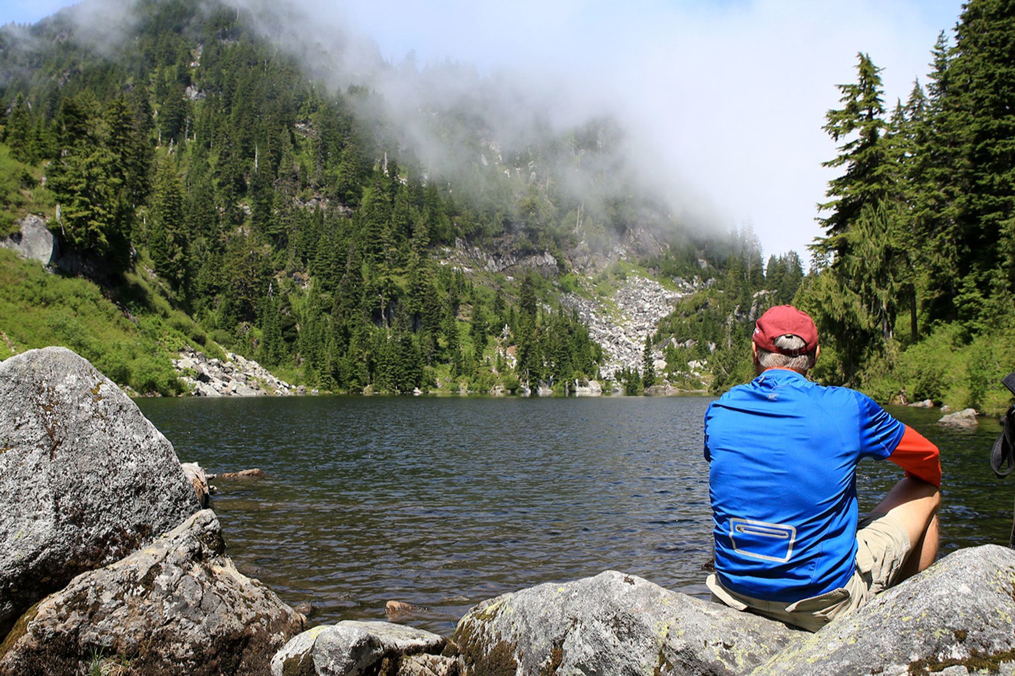 David Stodden hikes the Pinnacle Lake trail outside Granite Falls on Thursday morning. Stodden’s wife, Mary Cooper, and oldest daughter, Susanna Stodden, were killed July 11, 2006, on the trail. The case remains unsolved. (Kevin Clark / The Daily Herald)