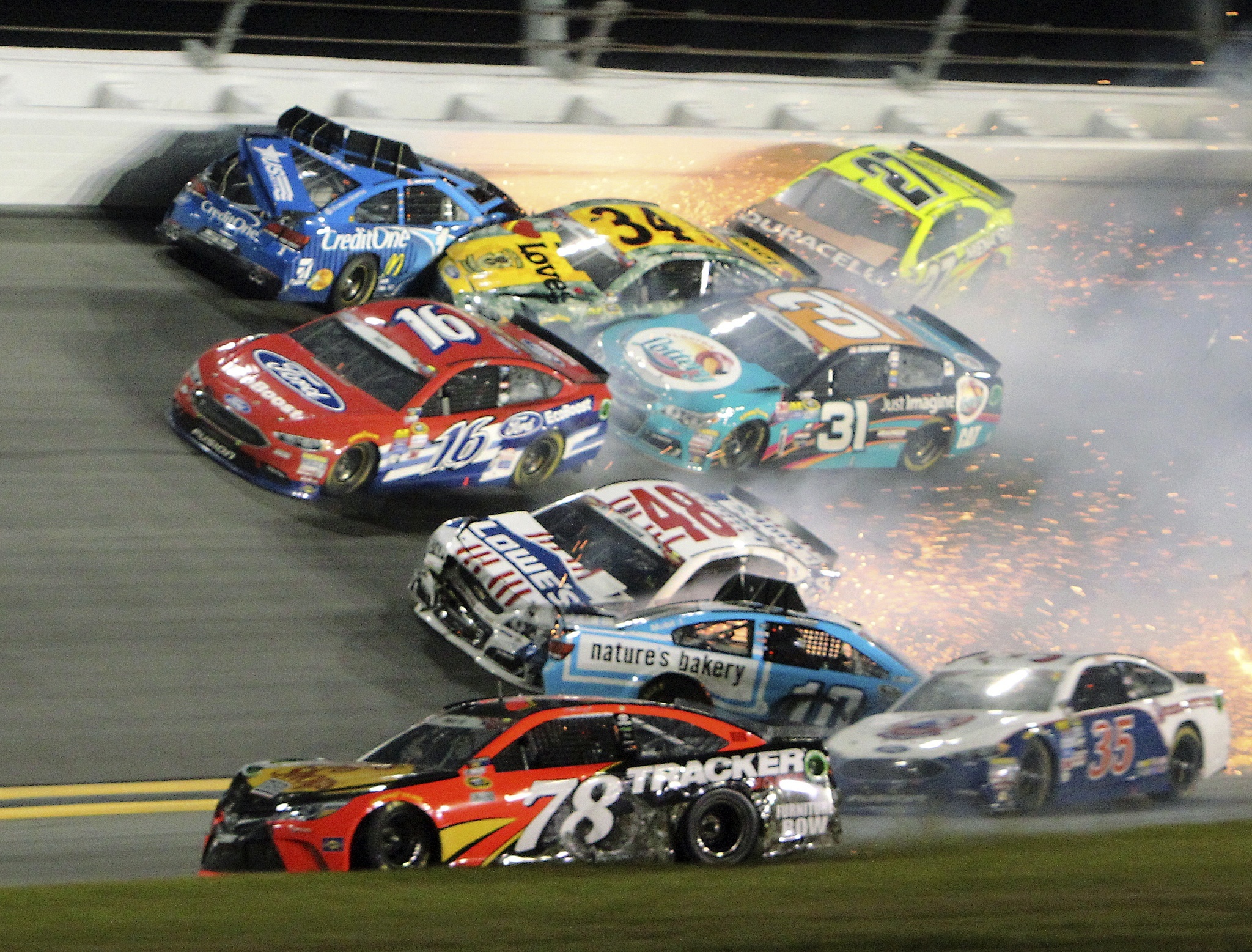 DOW GRAHAM / ASSOCIATED PRESS                                Jamie McMurray (top left) Greg Biffle (16), Jimmie Johnson (48), Martin Truex Jr. (78), Danica Patrick (10) Ryan Newman (31), Chris Buescher (34), Paul Menard (27) and others wreck during the Coke Zero 400 on Saturday at Daytona International Speedway.