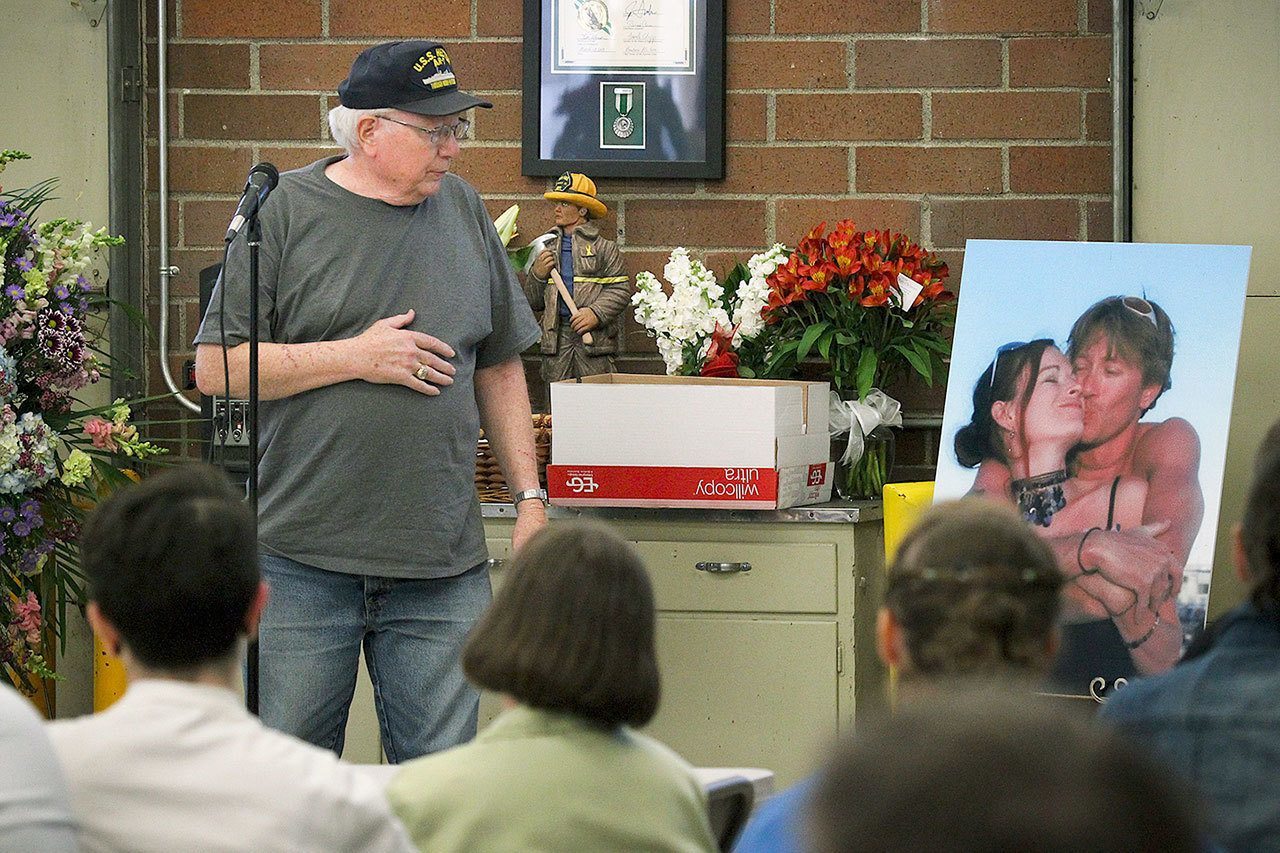 Mike Shunn pauses for a moment while sharing memories of his son, Patrick Shunn, and Patrick’s wife, Monique Patenaude, during an April 21 event at the Oso Fire Station to remember the couple who went missing April 11. The couple’s neighbor, John Reed, who officials believe is hiding out in Mexico, is suspected of murdering Shunn and Patenaude. Reed’s brother, Tony Reed, pleaded guilty to rendering criminal assistance. (Ian Terry / The Herald)