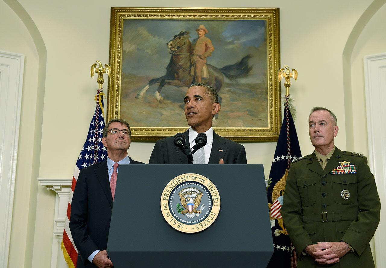 President Barack Obama, flanked by Defense Secretary Ash Carter, left, and Joint Chiefs Chairman Gen. Joseph Dunford, makes a statement on Afghanistan from the Roosevelt Room of the White House in Washington on Wednesday. The president said the U.S. will leave 8,400 troops in Afghanistan when he completes his term, down slightly from the current number but well up from the 5,500 he announced previously, arguing America’s interests depend on helping Afghanistan’s struggling government fight continuing threats from the Taliban and others. (AP Photo/Susan Walsh)