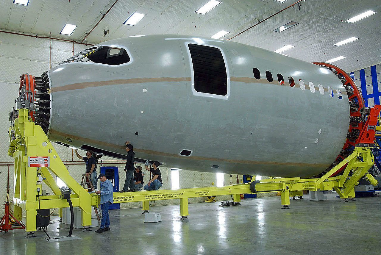 Herald file photo                                Spirit Aerosystems crews work on the nose section of a Boeing jet in 2007.