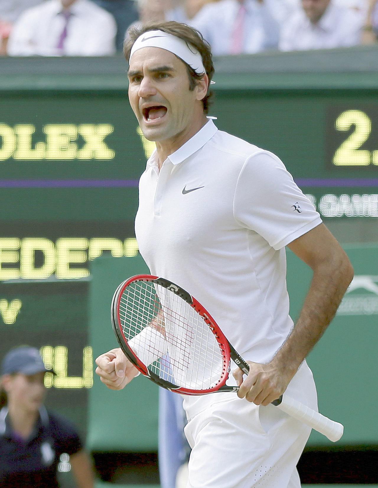 Roger Federer celebrates a point against Marin Cilic during their quarterfinal match at Wimbledon on Wednesday in London. Federer rallied for a five-set victory. (AP Photo/Tim Ireland)