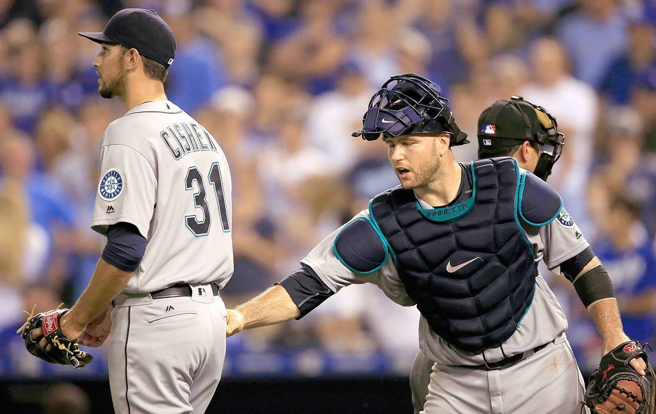 Mariners relief pitcher Steve Cishek (31) is encouraged by catcher Chris Iannetta after hitting a Royals batter with a pitch during the ninth inning of a game Thursday at Kauffman Stadium in Kansas City, Mo. The Royals defeated the Mariners 4-3. (AP Photo/Orlin Wagner)