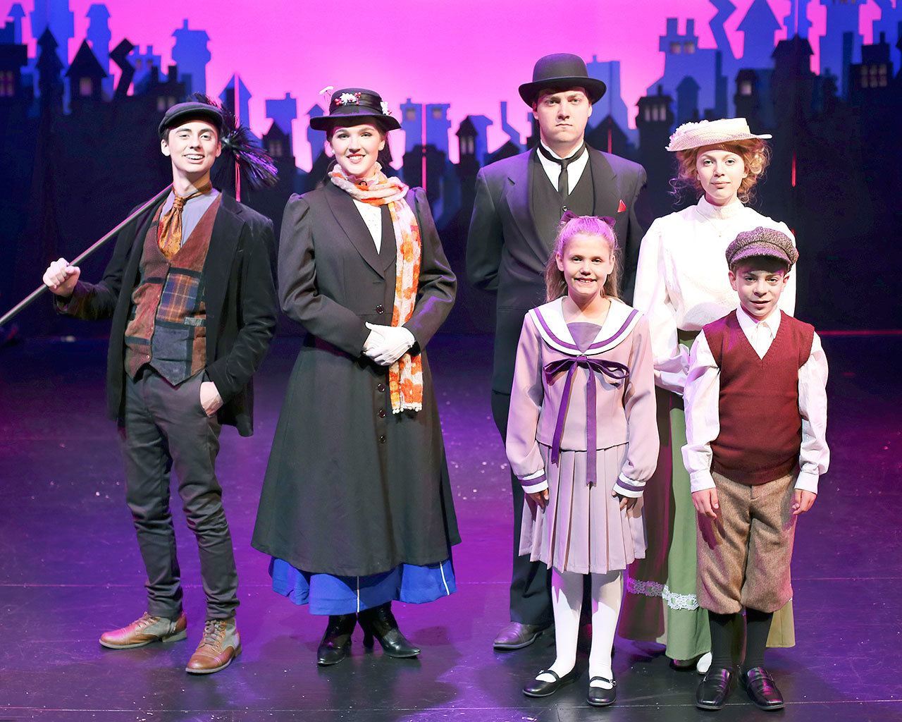 Ludus Performing Arts is presenting the musical “Mary Poppins” during July at the PUD theater in Everett. The cast includes, from left, Erik Ortiz as Bert, Maleah Haverly as Mary Poppins, Josh Pulley as George Banks, Madissen Allen as Winifred Banks, and, in front, Tessa Shevlin as Jane Banks and Teddy Shipley as Michael Banks. (Anne Julson)