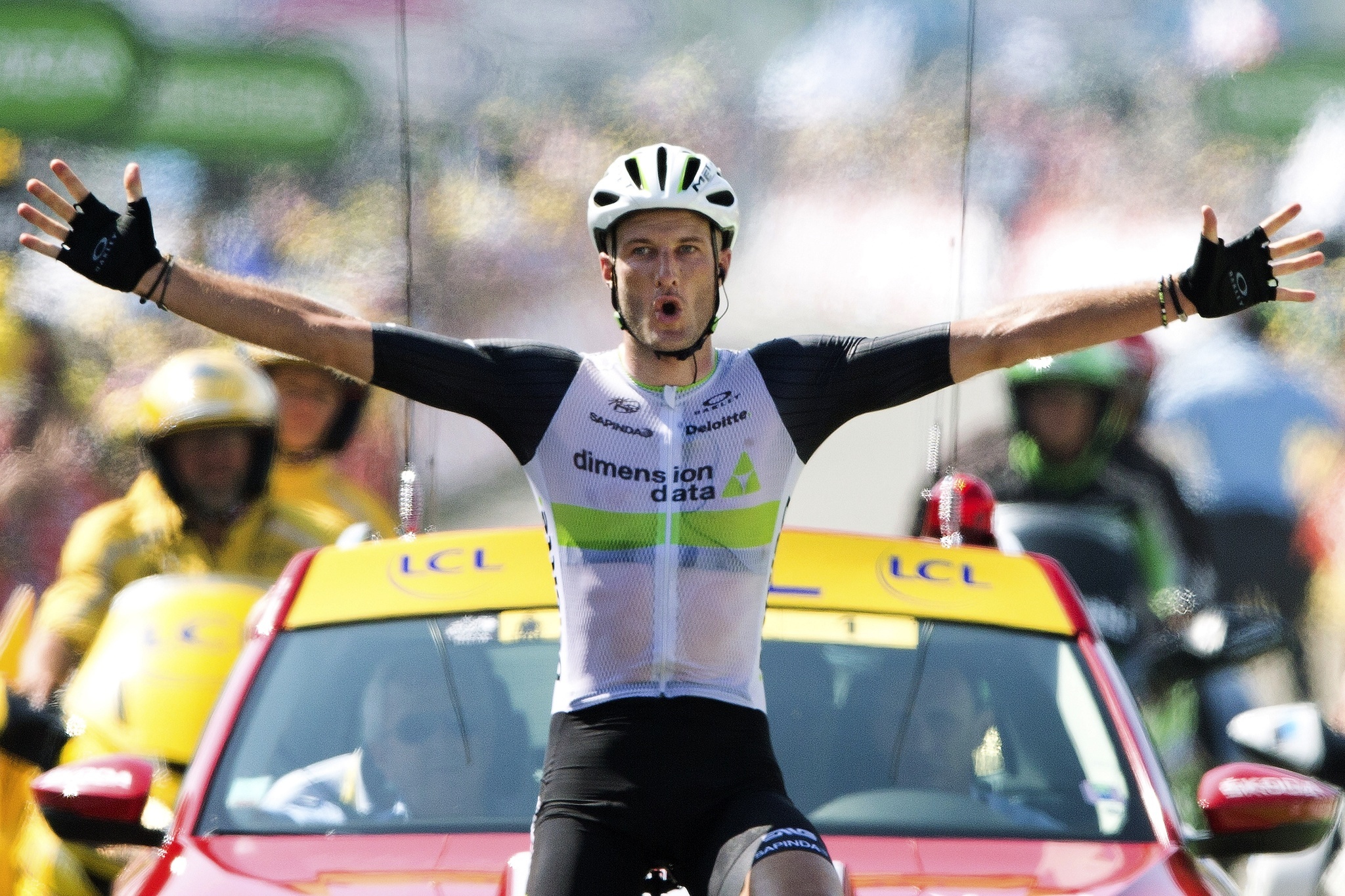 Britain’s Stephen Cummings crosses the finish line to win the seventh stage of the Tour de France over 100.7 miles between L’Isle-Jourdain and Lac de Payolle, France on Friday. (AP Photo/Peter Dejong)
