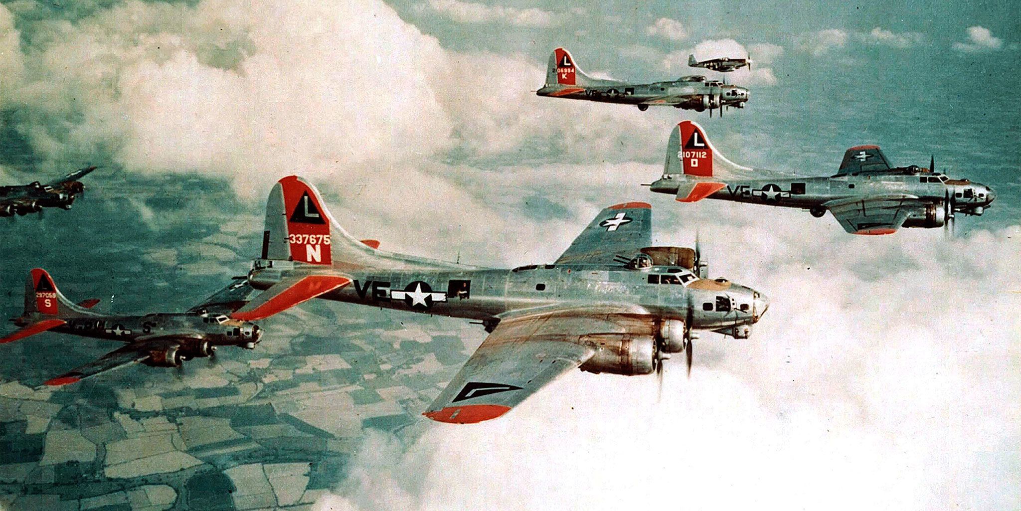 B-17G Fortresses of the 381st Bomb Group are escorted by a P-51B of the 354th Fighter Squadron in 1944. (National Archives and Records Administration)