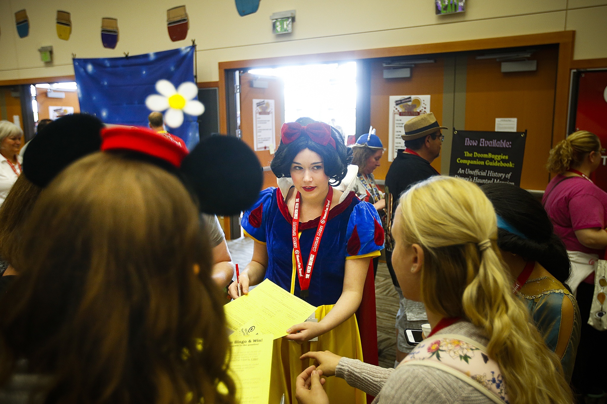 Dressed as Snow White, Eliana O’Neill (center), of Portland, chats with other Disney fans at the eighth annual Pacific Northwest Mouse Meet at the Lynnwood Convention Center on Saturday, July 9, 2016. (Ian Terry / The Herald)
