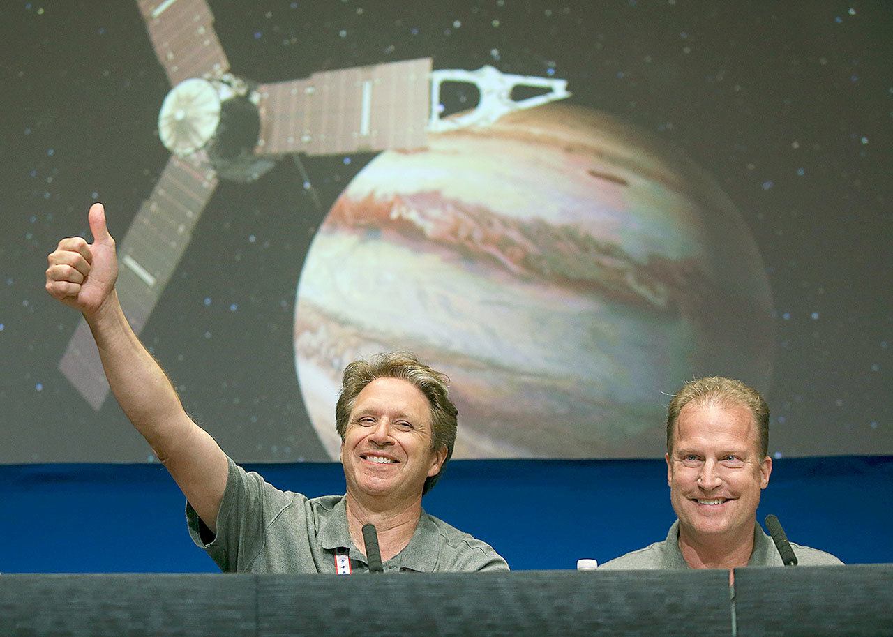 From left: Scott Bolton and Rick Nybakken during a briefing at NASA’s Jet Propulsion Laboratory in Pasadena, California, after the Juno spacecraft entered orbit around Jupiter on Monday. (AP Photo/Ringo H.W. Chiu)