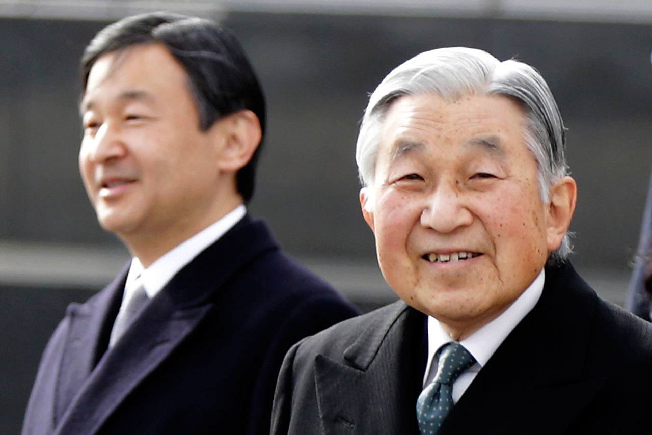 In this Jan. 26 photo, Japan’s Emperor Akihito, right, and Crown Prince Naruhito, left, walk at Haneda international airport in Tokyo. Japan’s public television said Wednesday that Akihito has expressed intention to retire while still alive. (AP Photo/Eugene Hoshiko, File)
