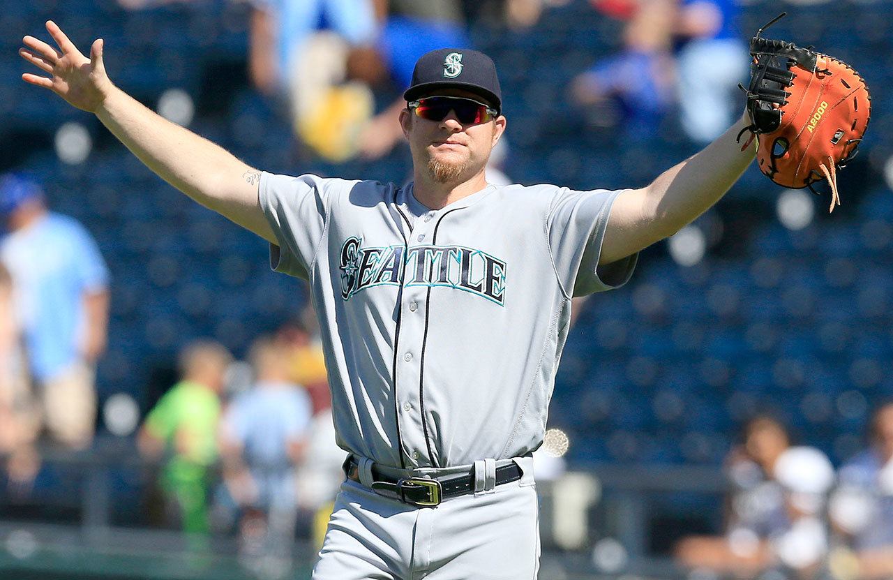Mariners first baseman Adam Lind celebrates following a game against the Royals last week at Kauffman Stadium in Kansas City, Mo. (AP Photo/Orlin Wagner)