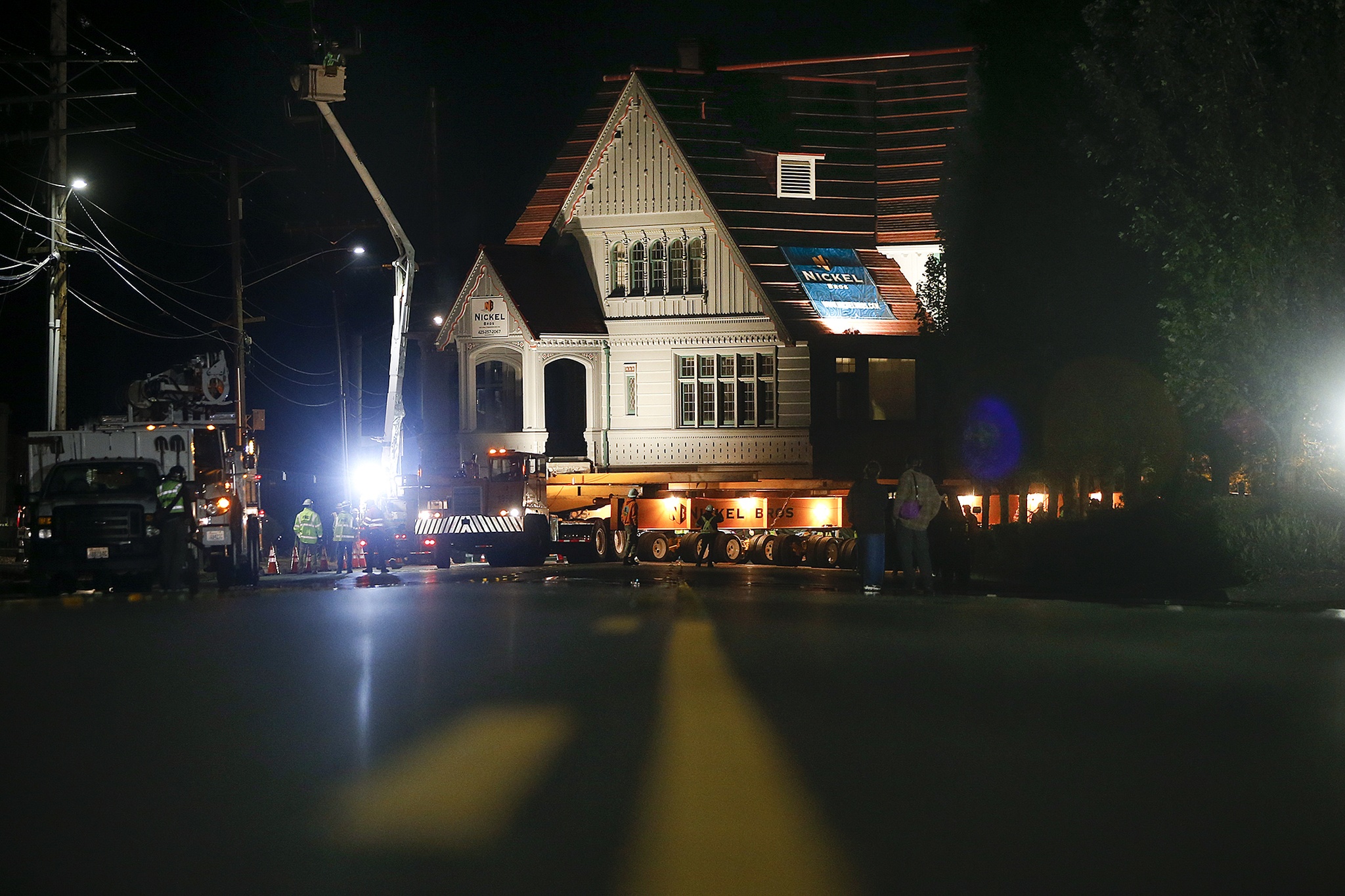 The 350-ton historic Weyerhaeuser Office Building moves onto West Marine View Drive in Everett during its relocation from the Port of Everett’s South Marina to the new Boxcar Park in the Central Marina early Thursday morning. (Ian Terry / The Herald)