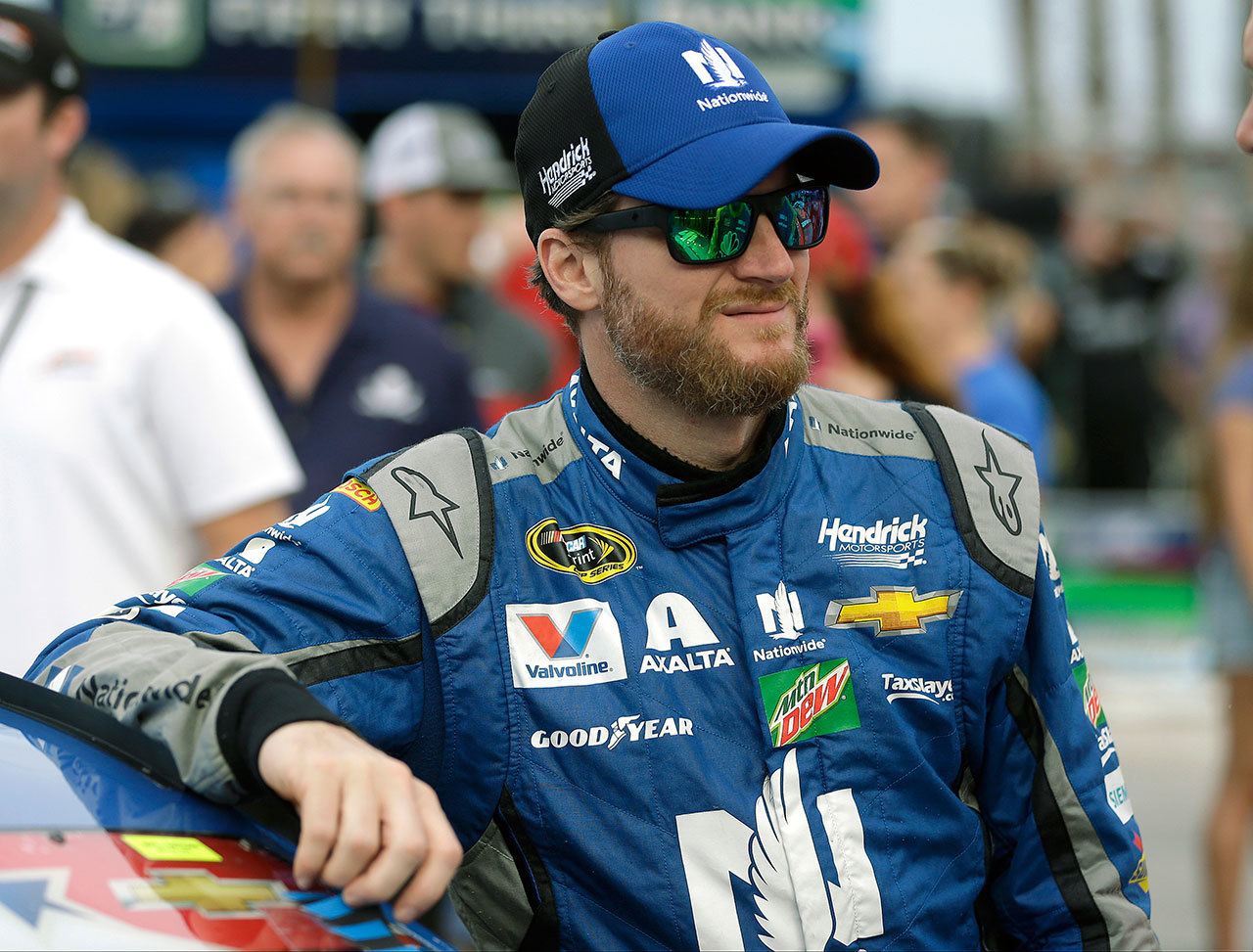 Dale Earnhardt Jr. waits by his car before a NASCAR Sprint Cup race at Daytona International Speedway on July 2. Earnhardt was scratched from this weekend’s race at New Hampshire due to concussion symptoms. (AP Photo/John Raoux)