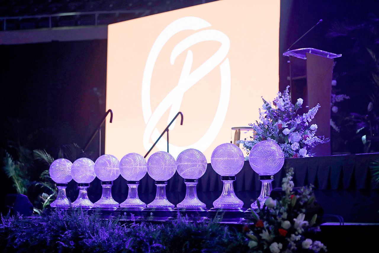 The eight national championship trophies won by former Tennessee women’s basketball coach Pat Summitt sit in front of the stage before a public celebration of her life Thursday in Knoxville, Tenn. Summitt died June 28 at the age of 64. (AP Photo/Mark Humphrey, Pool)