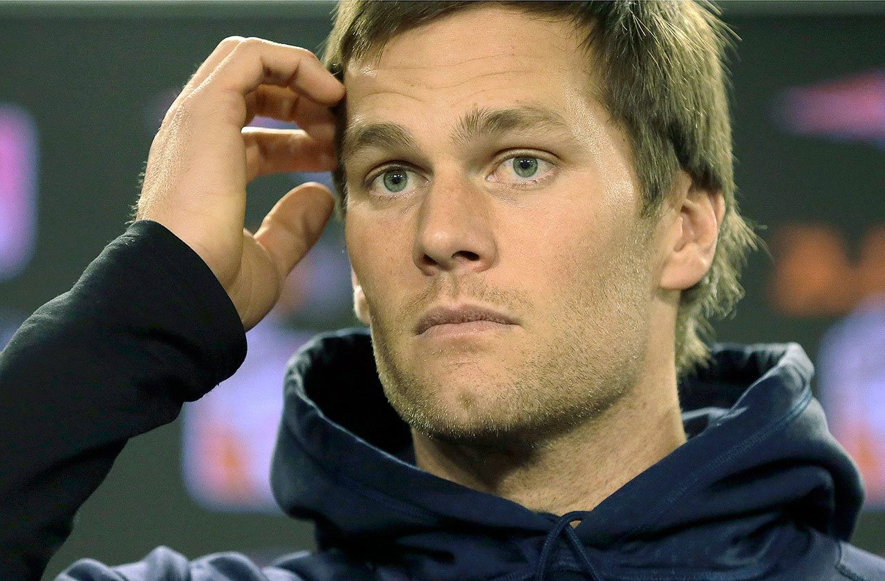 New England Patriots quarterback Tom Brady has dropped his appeal and will serve a four-game suspension for doctoring the footballs used in a Jan. 18, 2015, playoff game. (AP Photo/Steven Senne, File)