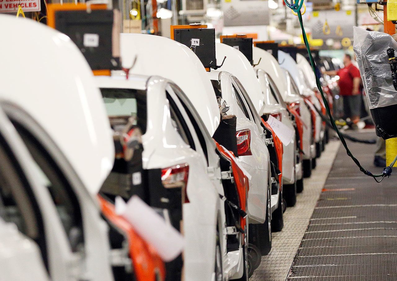 An assembly line of new 2016 Altimas await backseat installations at the Nissan Vehicle Assembly Plant in Canton, Mississippi, in April. (AP Photo/Rogelio Solis)