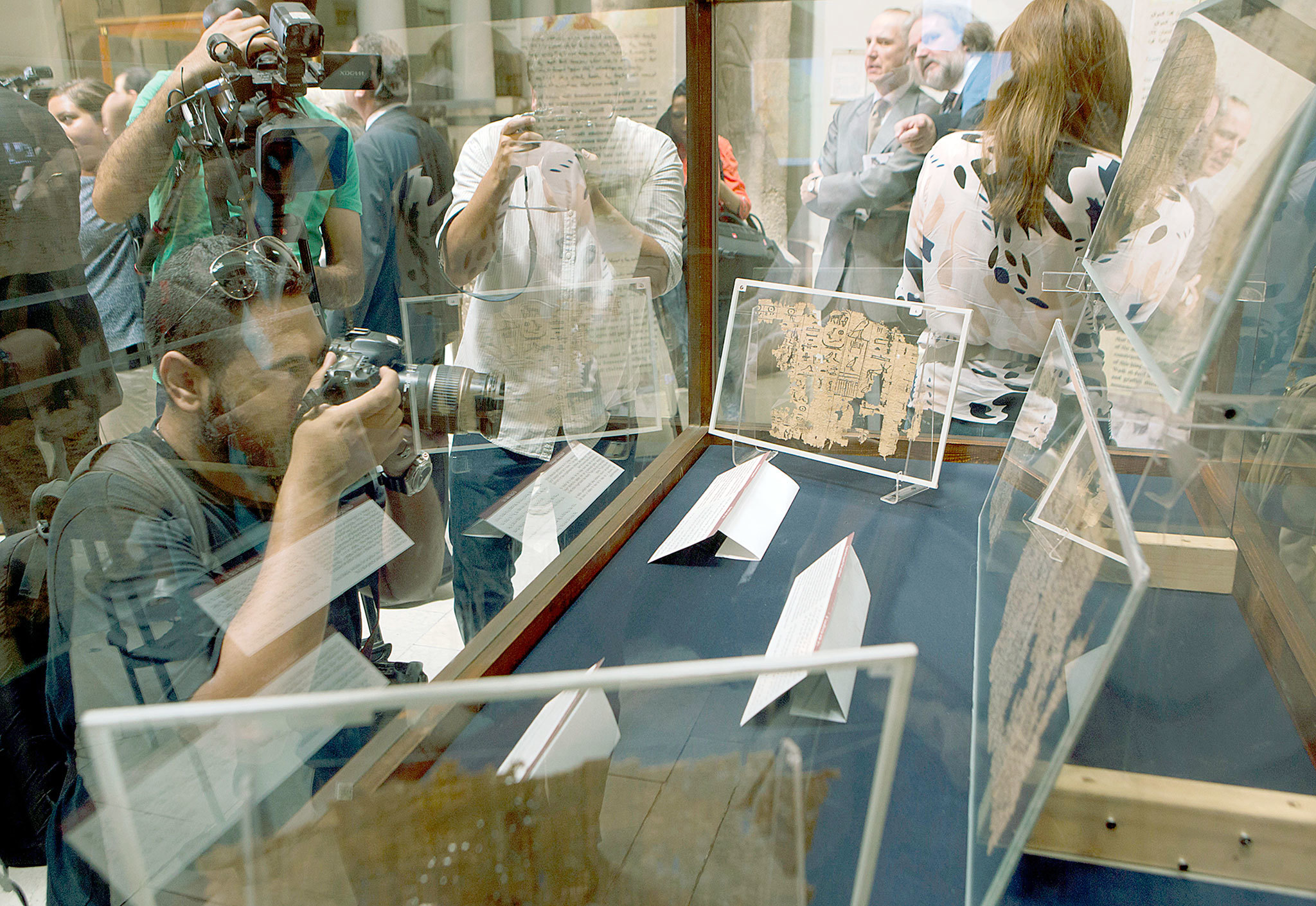 Visitors and cameramen surround the collection of King Khufu papyri on display for the first time at the Egyptian museum in Cairo on Thursday. (AP Photo/Amr Nabil)