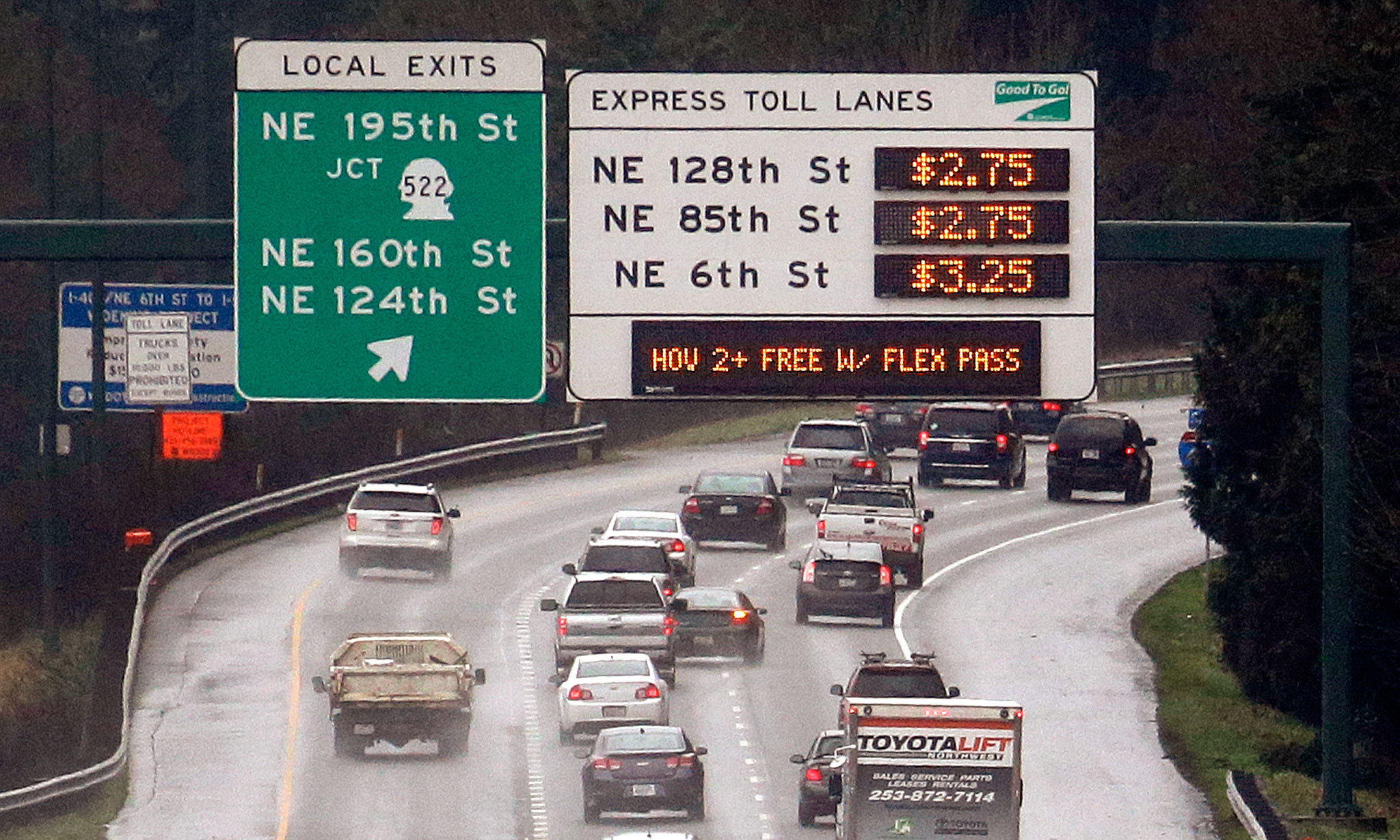 Signs show the rates for using the express toll lanes for traffic headed southbound on I-405 in Bothell. (AP Photo/Elaine Thompson)