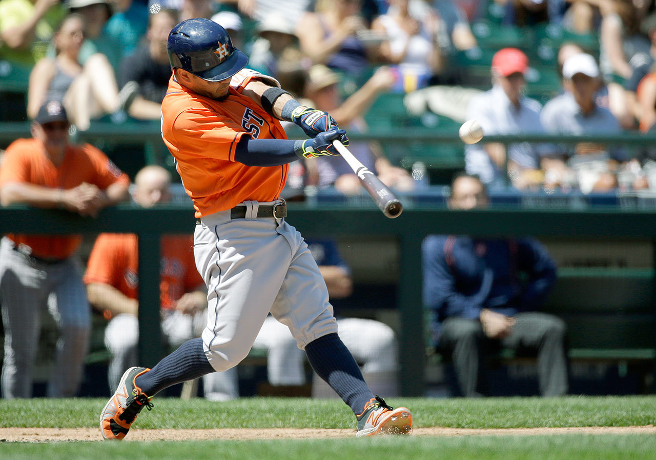 Houston’s Jose Altuve hits a two-run home run on a 3-0 pitch in the third inning of Sunday’s game at Safeco Field. (AP Photo/Ted S. Warren)