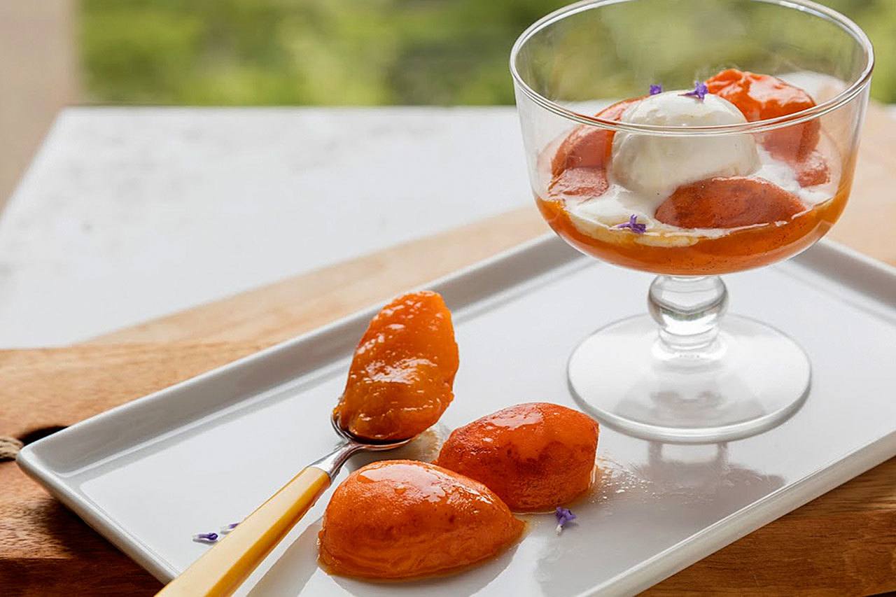 Pan-grilled apricots with honey-orange lavender syrup. (Goran Kosanovic / For The Washington Post)