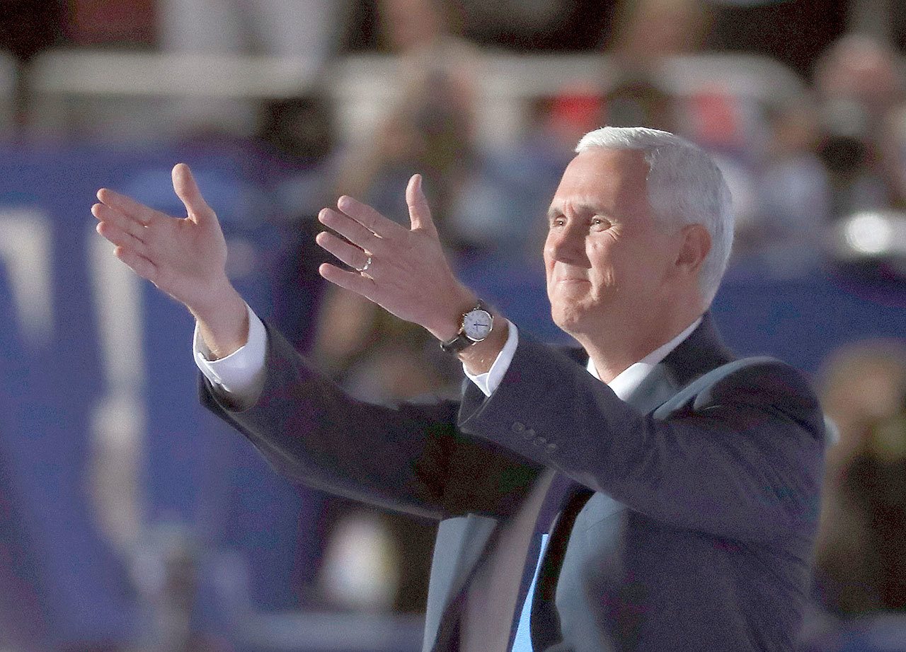 Republican vice presidential nominee, Gov. Mike Pence of Indiana, takes the stage during the third day of the Republican National Convention in Cleveland on Wednesday. (AP Photo/Paul Sancya)