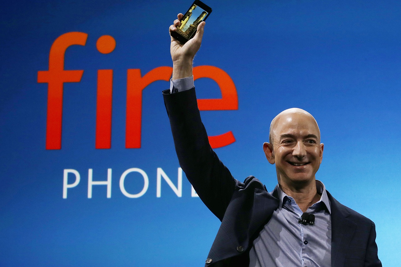 In this 2014, photo, Amazon CEO Jeff Bezos introduces the new Amazon Fire Phone in Seattle. Bloomberg’s billionaire index shows Bezos moved past Warren Buffet to become the third richest person in the world on Thursday. (AP Photo/Ted S. Warren, File)