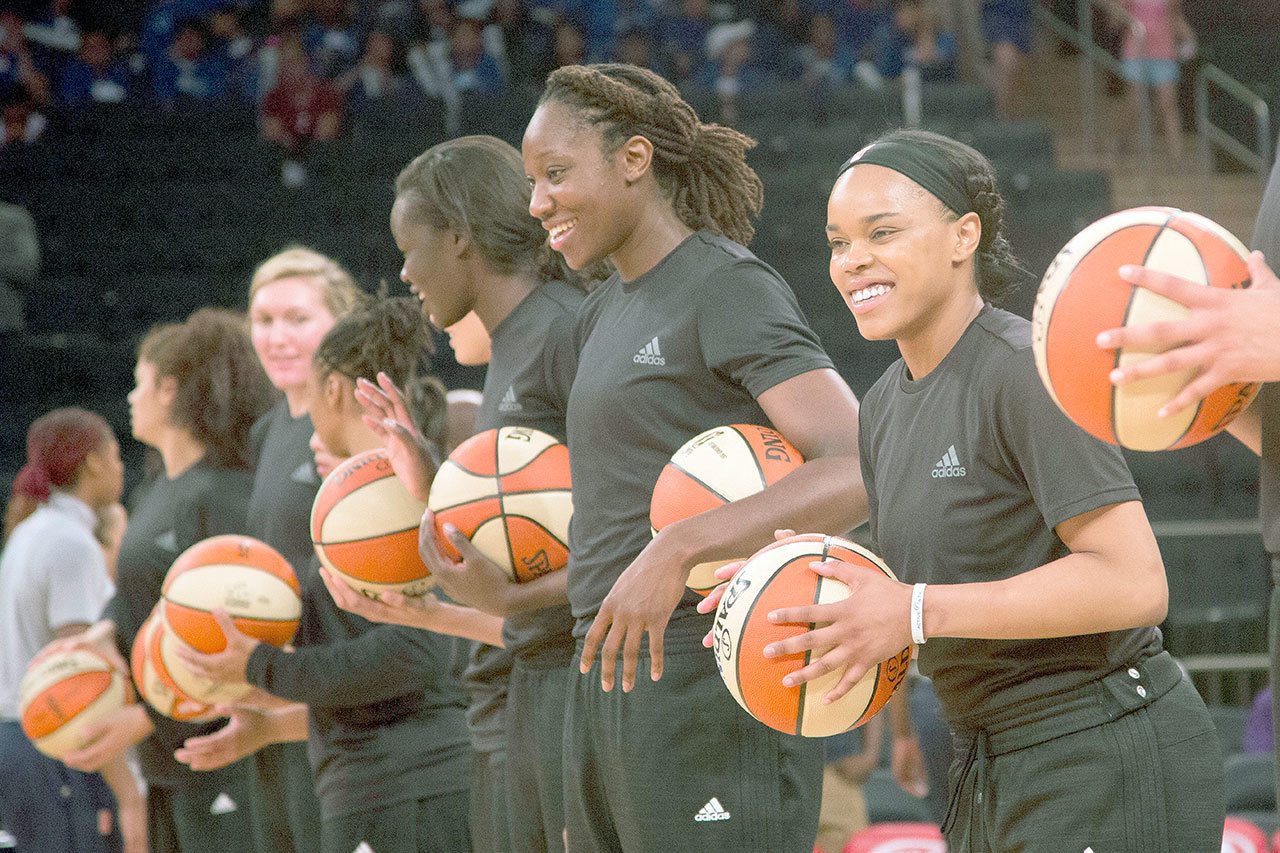Members of the WNBA’s New York Liberty wear black warm-up shirts in solidarity with the Black Lives Matter movement before a game against Atlanta on July 13 in New York. All players across the league that wore the shirts were initially fined by the league, but the WNBA withdrew the fines on Saturday. (AP Photo/Mark Lennihan)