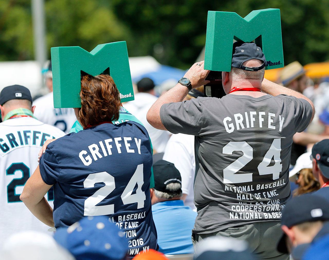 Fans of inductee Ken Griffey Jr. stand at the start of the National Baseball Hall of Fame induction ceremony Sunday in Cooperstown, New York. (AP Photo/Mike Groll)