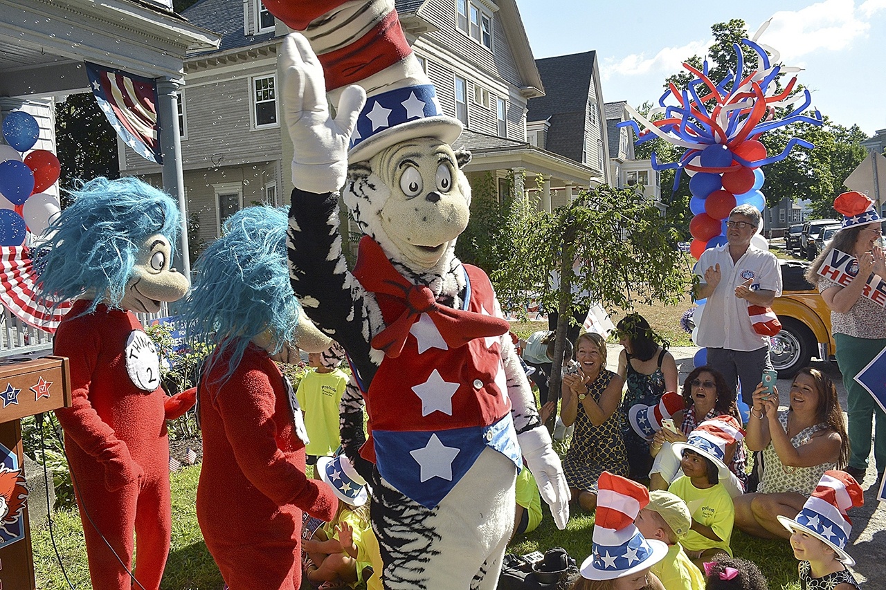 A character portraying the Cat in the Hat announces Tuesday he is running for President with running mates Thing 1 and Thing 2 outside the childhood home of their creator Theodor Geisel, better known as Dr. Seuss, on Fairfield Street in Springfield, Massachusetts. The event served as the official launch for the new Random House book “One Vote, Two Votes, I Vote, You Vote.” (Dave Roback/The Republican via AP)