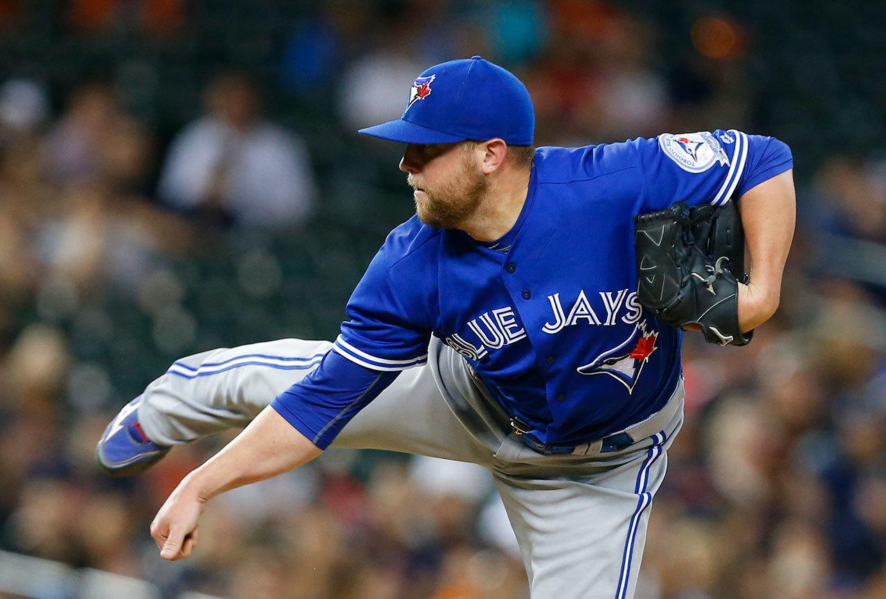 Mariners relief pitcher Drew Storen, seen here with the Blue Jays before a Tuesday trade shipped him to Seattle, was a big Ken Griffey Jr. fan growing up. Storen hopes to get his rough season on track with the Mariners. (AP Photo/Paul Sancya)
