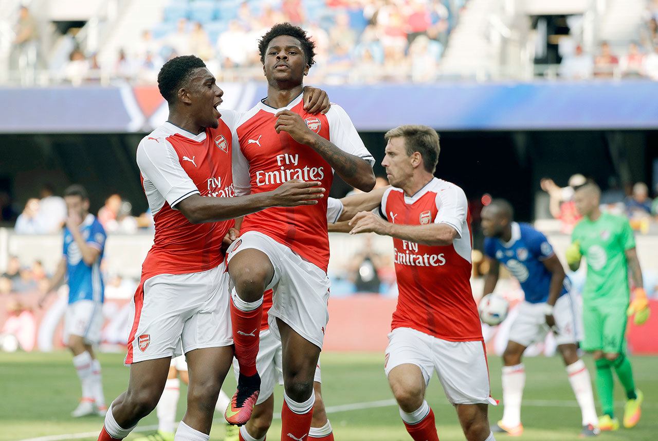 Arsenal forward Chuba Akpom (center) celebrates his goal with teammate Alex Iwobi (left) during the second half of the MLS All-Star game on Thursday in San Jose, Calif. Arsenal defeated the MLS All-Stars 2-1. (AP Photo/Marcio Jose Sanchez)