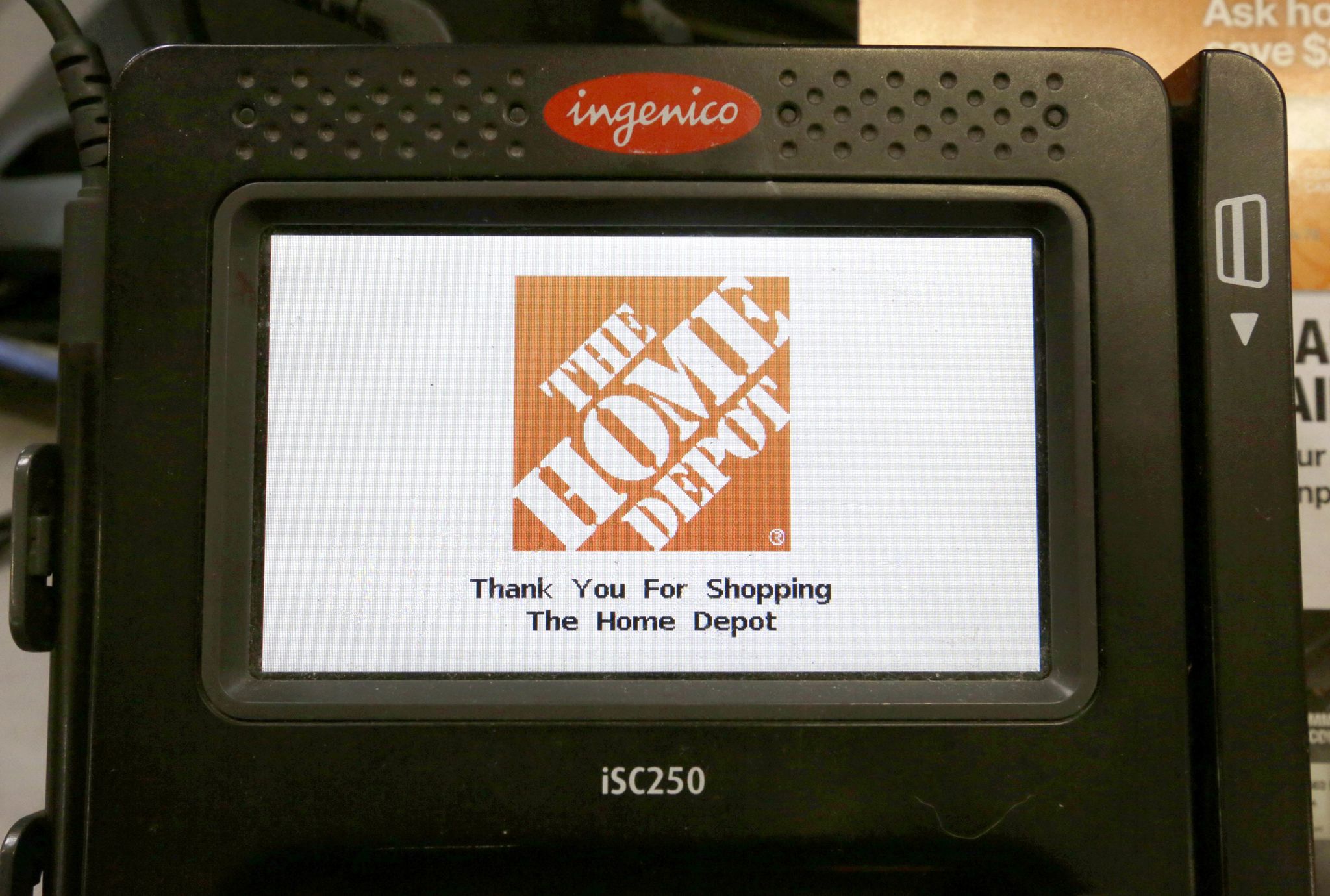 The Home Depot logo appears on a credit card reader at a Home Depot store in Bellingham, Massachusetts.