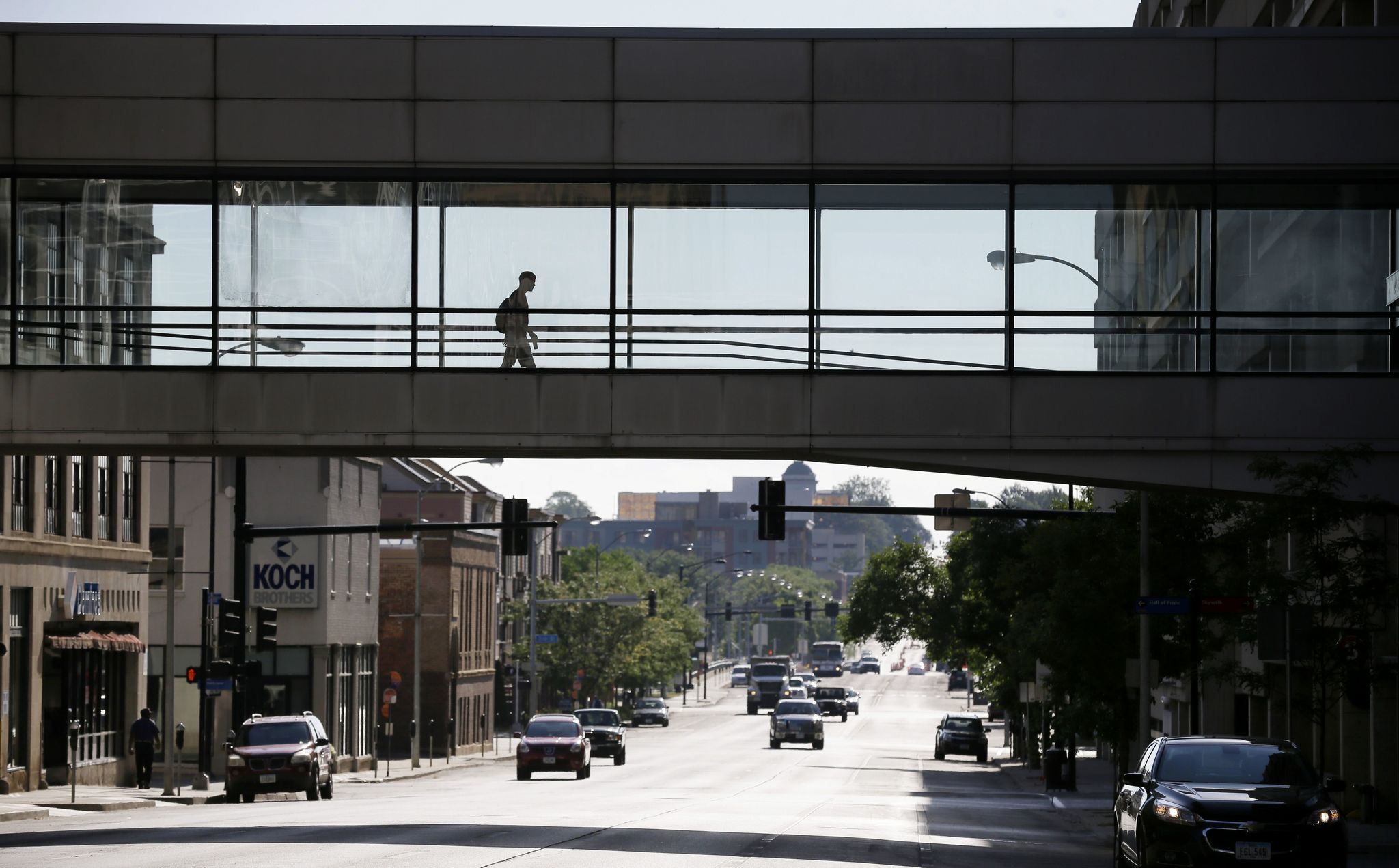 A man makes his way through a skywalk over a downtown street Friday in Des Moines, Iowa.