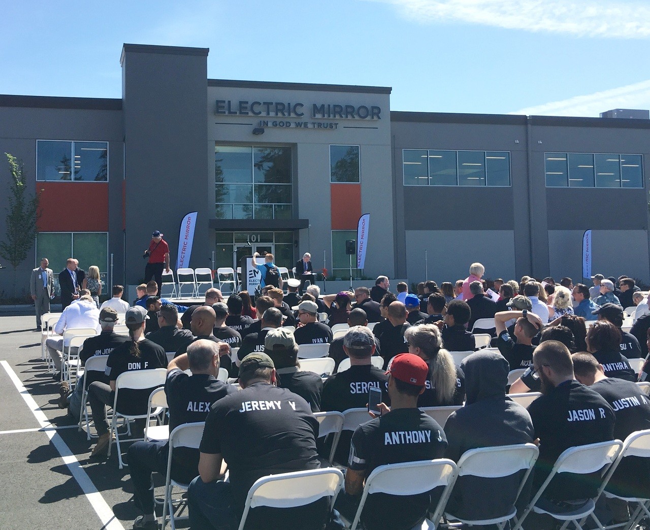 Dozens gathered to celebrate the opening of Electric Mirror’s headquarters and manufacturing plant on Friday.