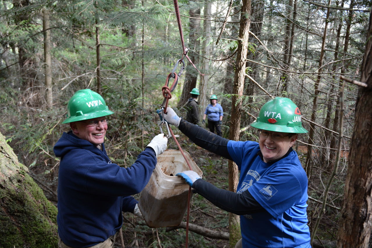 Washington Trails Association volunteers work on the Tursi Trail on Fidalgo Island. The trail officially opens to the public on June 4.