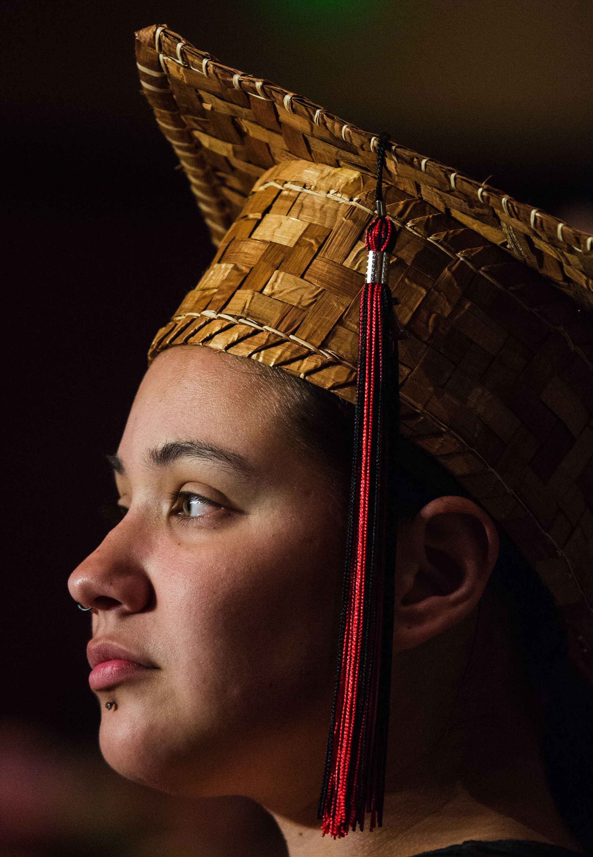 Malia Grato wears a woven cedar mortarboard during the banquet. The hats take nearly five hours each to make. The cedar graduation hats were made by Judy Gobin and her daughter, Toni Jo Gobin, made 105 this year.