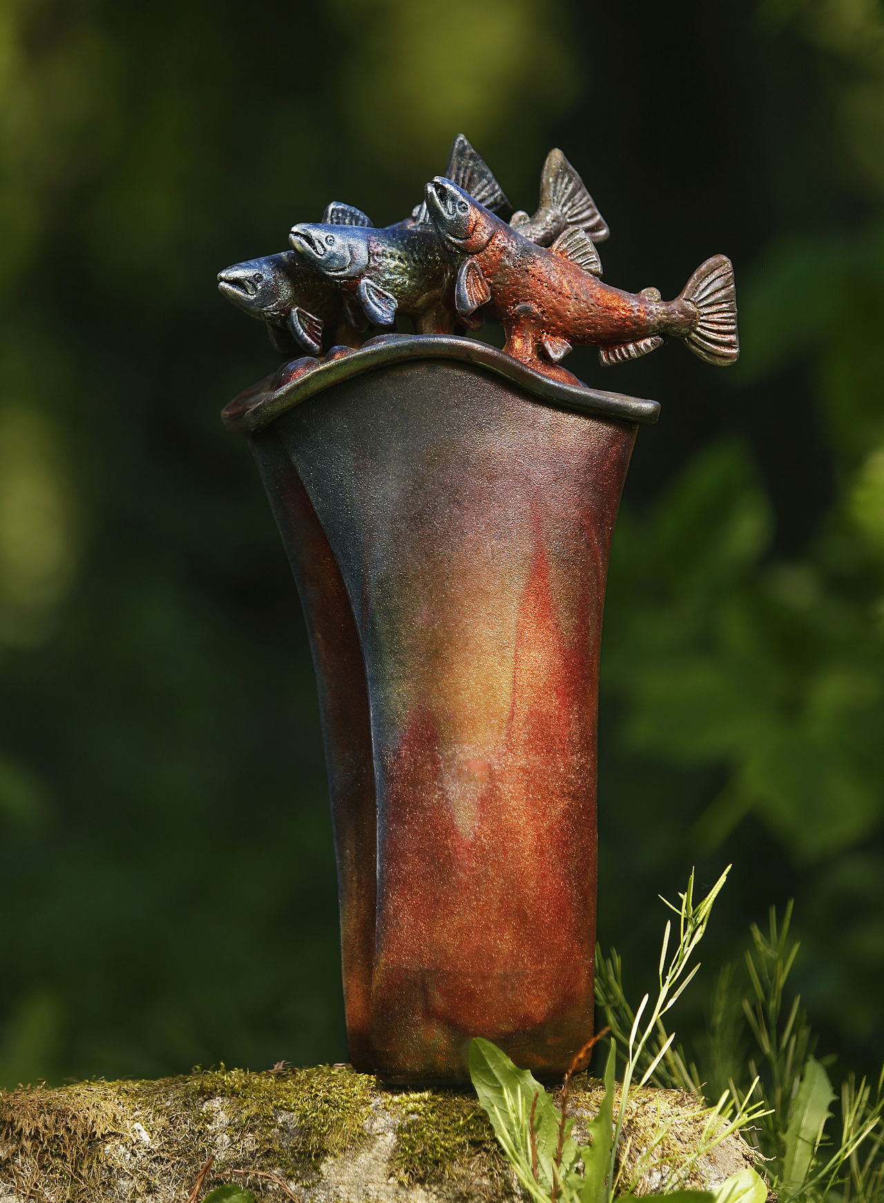 Clay artist Marguerite Goff’s raku pot “River Dance” is featured on this year’s Camano Island Studio Tour poster and guide.