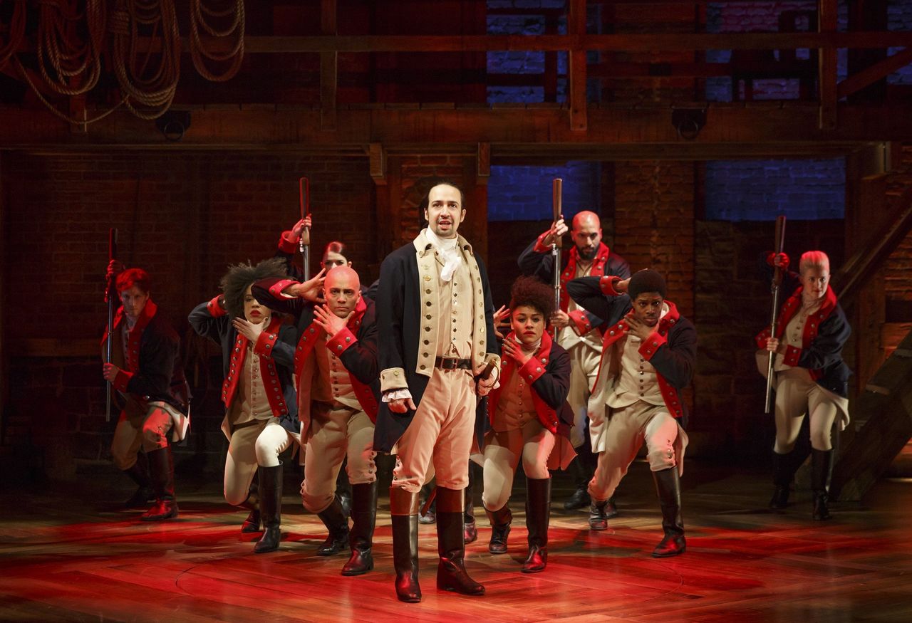 Lin-Manuel Miranda, center, performs in the musical “Hamilton” in New York.