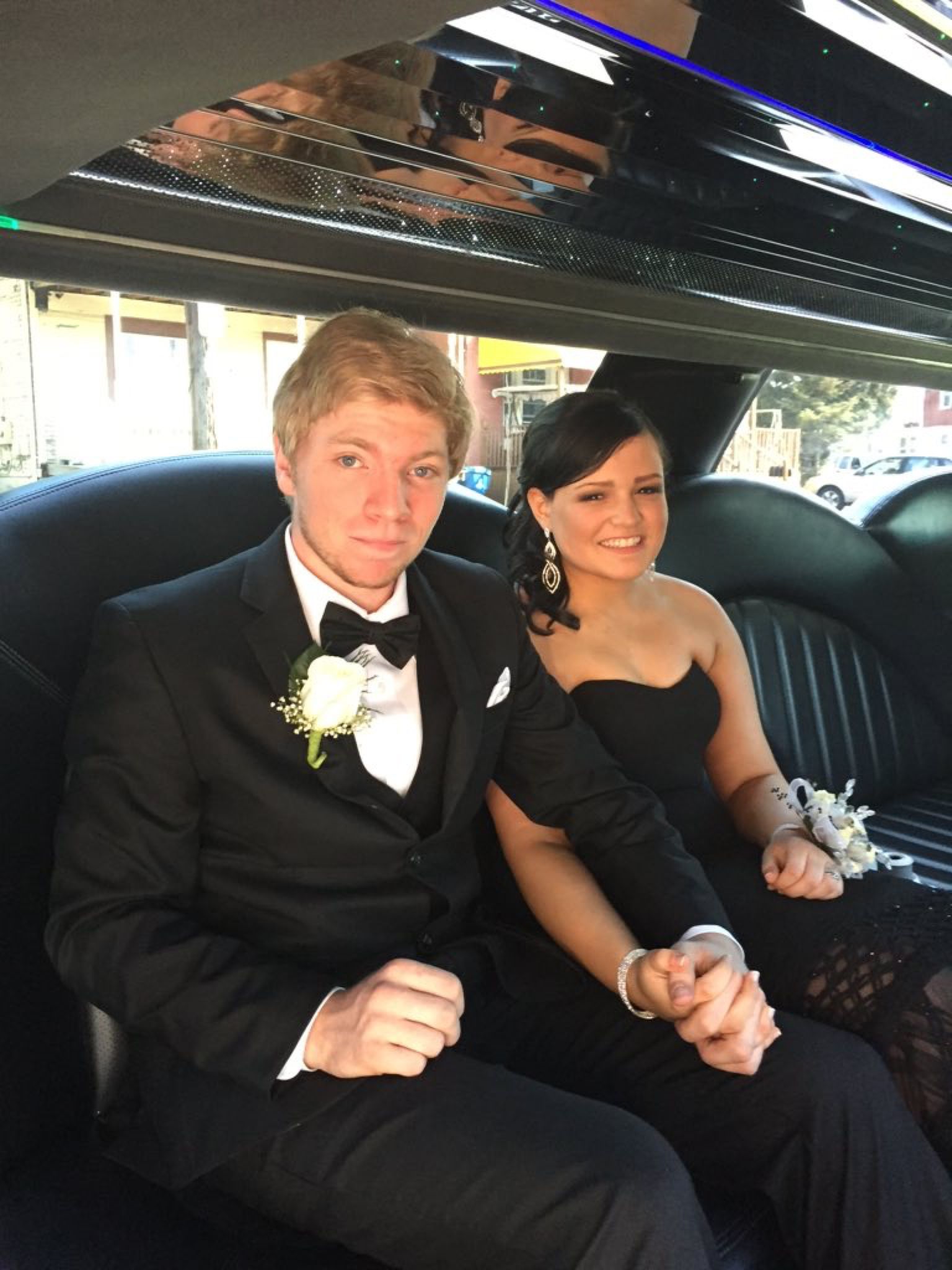 Jessica Casanova, 17, holds hands with her prom date, Nathan Cohen, in Buffalo, New York. Casanova wore the black Badgley Mischka gown that actress Gina Rodriguez wore to the 2015 Golden Globe Awards.