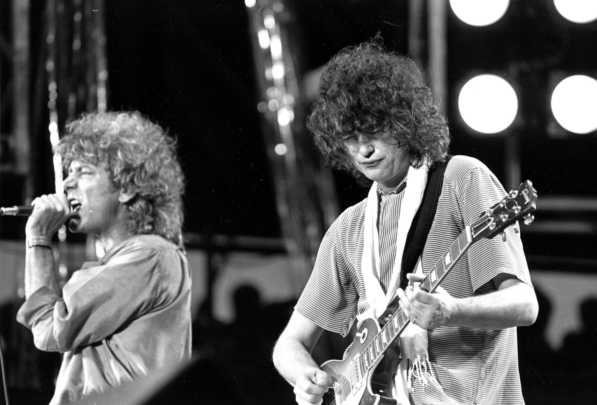 Robert Plant and guitarist Jimmy Page of the British rock band Led Zeppelin perform at the Live Aid concert at Philadelphia’s J.F.K. Stadium on July 13, 1985.