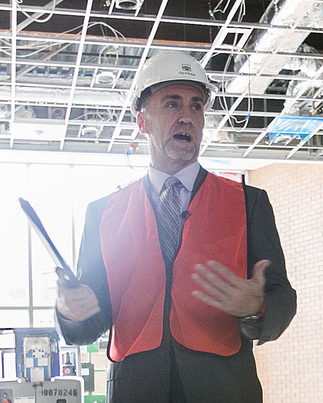 Bothell City Manager Bob Stowe tours the new city hall during its construction in September 2015. He was fired Tuesday night by the Bothell City Council.