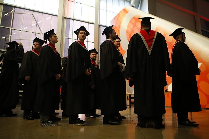 Graduates line up Sunday before entering the Washington State University North Puget Sound at Everett’s commencement ceremony at the Future of Flight in Mukilteo.