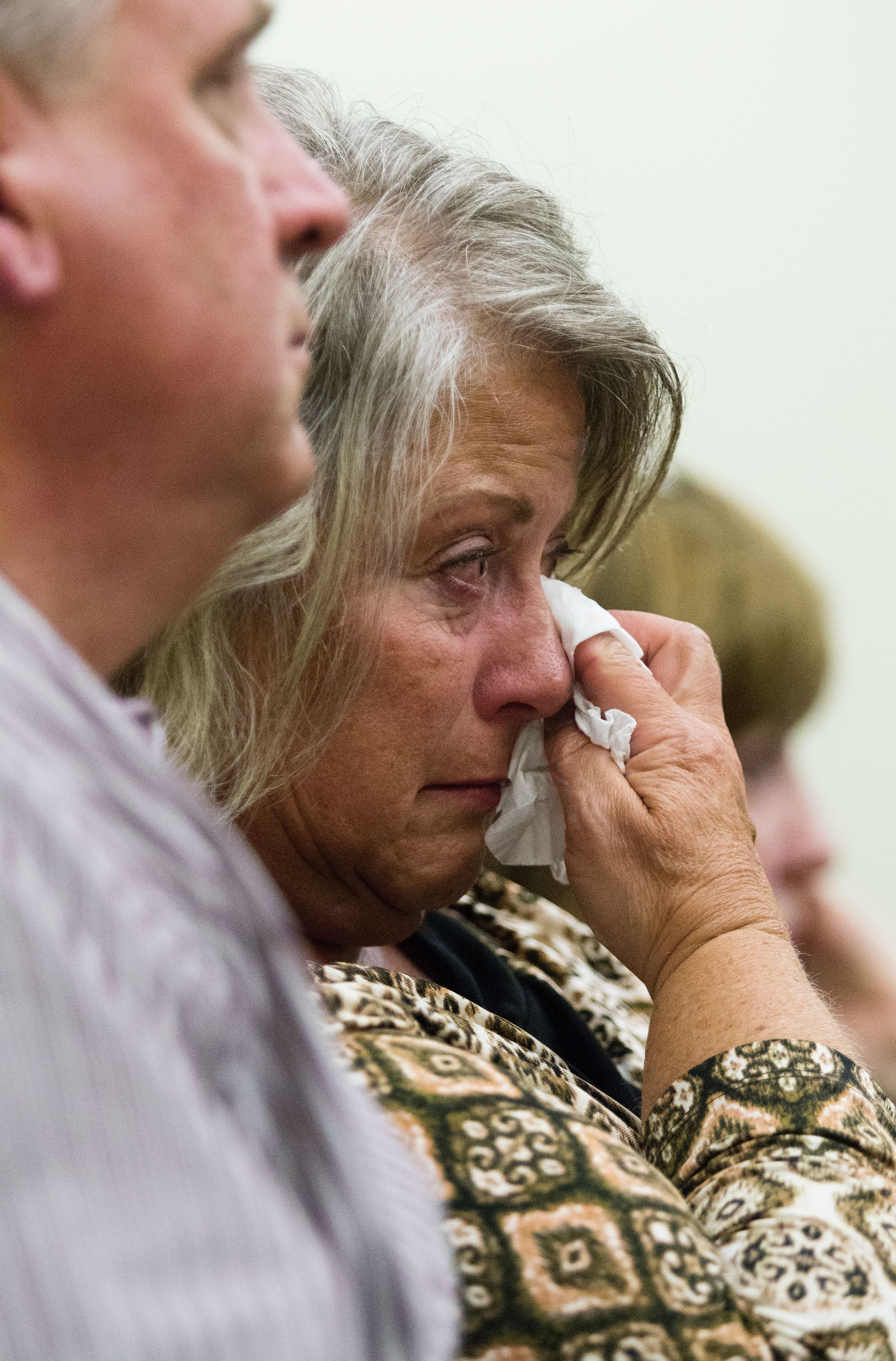 Denise Webber wipes her eyes as details of the murder of her daughter, Rachel Rose Burkheimer, are explained during opening statements Monday in the trial of John Alan Whitaker at the Snohomish County Courthouse in Everett.